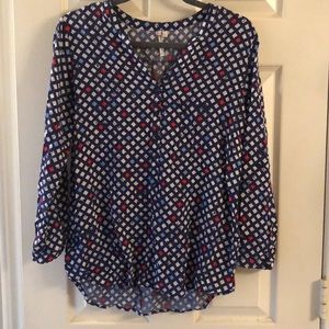 Red and blue patterned blouse